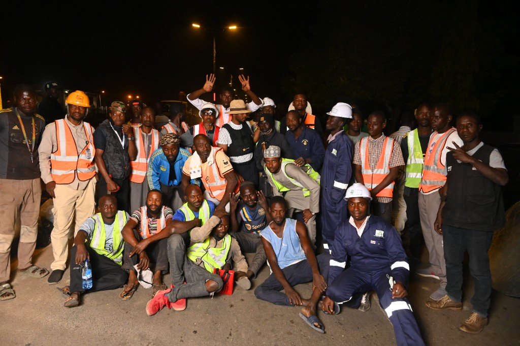 The local night crew on a Street Lights corridor — hired and trained on site, not flown in