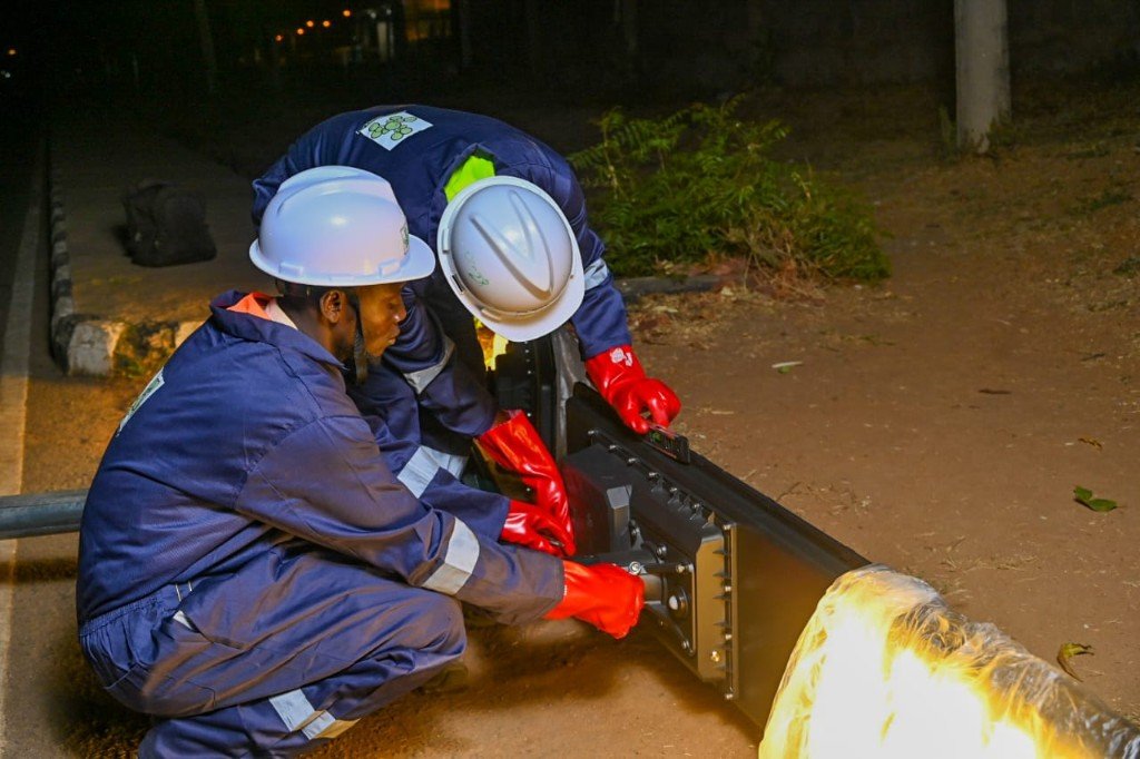 Technicians assembling a solar luminaire during on-the-job training